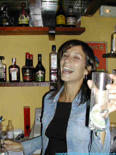 Reveller offering a drink, candid shot