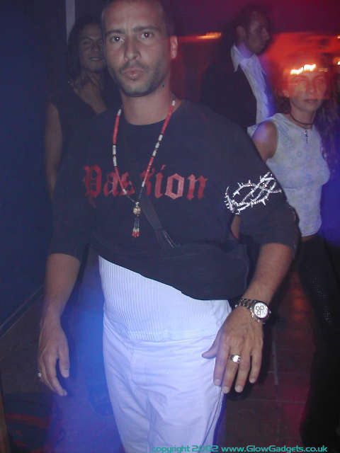 Reveller in frog-themed UV costume