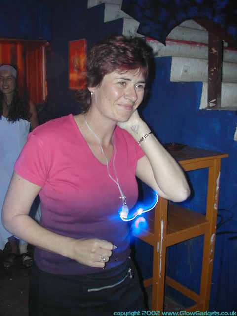 Reveller glowing under UV light