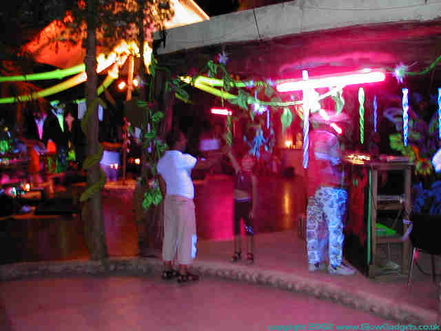 Market stalls lit UV at Tribe of Frog